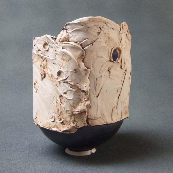 sculpture-vase with hole in side, semi liquid texture