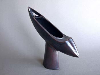 flying boat shaped sculpture, black glaze