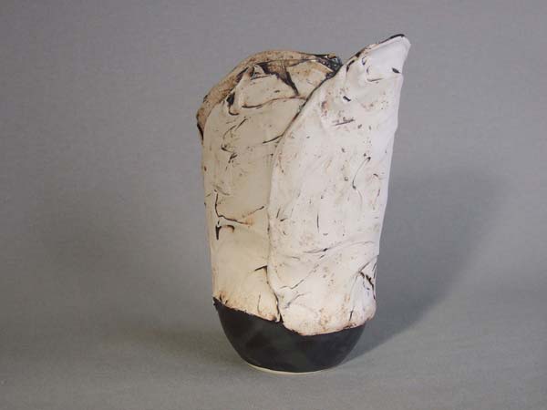 sculpture-vase with black inside, semi liquid texture outside